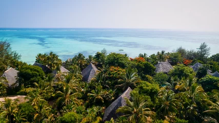 Papier Peint photo Plage de Nungwi, Tanzanie Aerial drone photography captures the breathtaking beauty of Zanzibar's crystal clear waters and white sandy beaches in Nungwi.