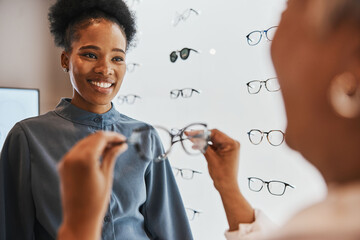 Glasses, black woman and retail customer with store worker and optician looking at lens. Eye...