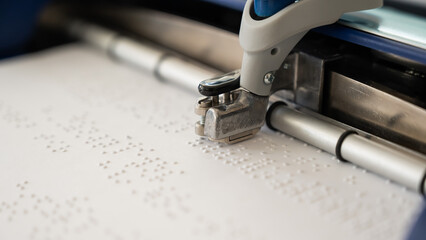Close-up of a braille code printing machine. 