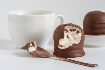 Israeli winter dessert Krembo (cool whip candy) on white background.