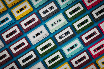 Top view of old cassette tapes in various colors, 3d rendering