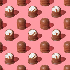 Seamless pattern with Israeli winter dessert Krembo (cool whip candy) on pink background.