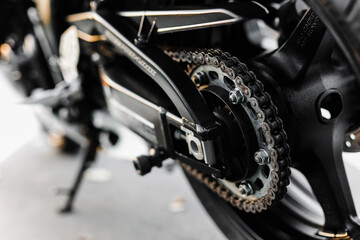 Fototapeta na wymiar motorcycle rear wheel with brake disc close-up.