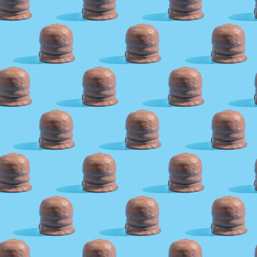Seamless pattern with Israeli winter dessert Krembo (cool whip candy) on blue background.
