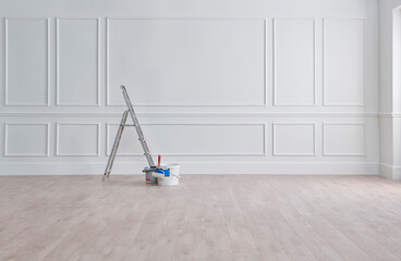 Fototapeta White classic wall, stairs, paint and brush, interior whitewash. obraz