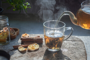 Tea hot drink on old background in composition on the table