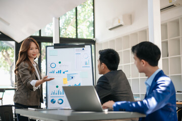 Business team discuss at meeting room. working together with laptop ,tablet and smart phone on desk Financial accountant , planner , meeting concept. At office.