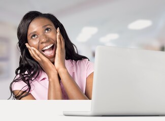 Young busy angry woman work on laptop