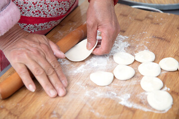 Roll dough dumplings on a cutting board