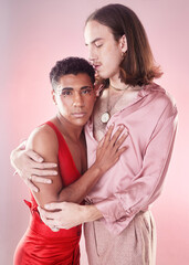 Gay, portrait and people hug isolated on pink background in beauty glow, pastel and creative art aesthetic. Fashion, diversity and love, queer and transgender couple of friends in makeup or cosmetics