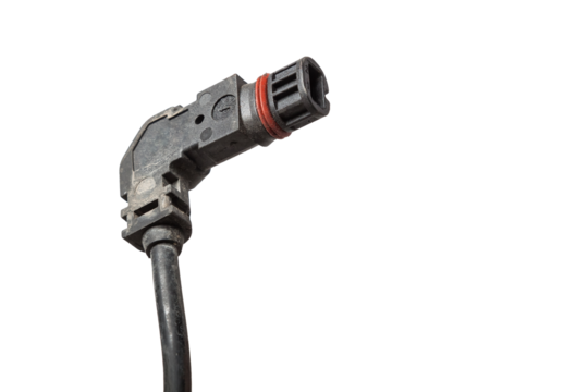 A modern car connector or trailer for closing an electrical circuit that a mechanic holds in gloves during repairs.