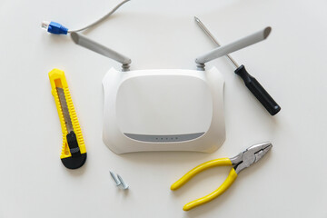 Repairing tools with a wireless wifi router on the table. Top view.