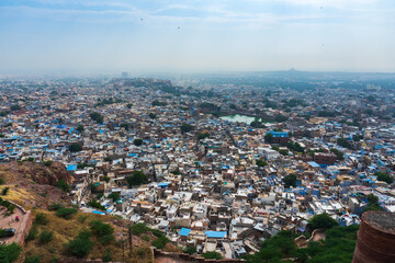 Obraz premium Beautiful top view of Jodhpur city from Mehrangarh fort, Rajasthan, India. Jodhpur is called Blue city since Hindu Brahmis there worship Lord Shiva, whose colour is blue, they painted houses in blue.