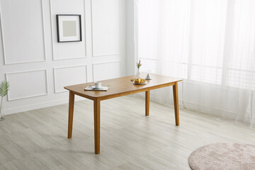 Wood dining table landscape with sunlight.