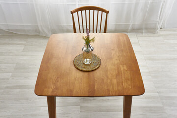 Wood dining table landscape with sunlight.