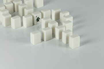 Still life of mahjong tiles on dollar sign with Chinese character Fa which means wealth