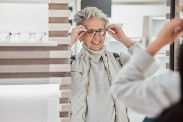 Senior woman, glasses and eye care at mirror with patient shopping for vision lens or frame in...