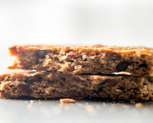 Fototapeta premium Broken brown biscuit with nuts and seeds