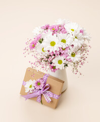 Gift box, Easter eggs and flowers