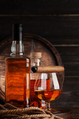 Glass and bottles with cognac