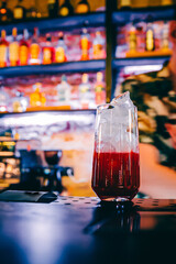 man hand bartender making cocktail in glass on the bar counter