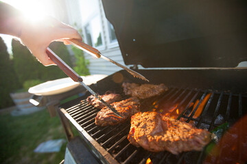 Meat cooking on barbecue grill