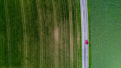 Car surrounded by fields, Genolier, Vaud Canton, Switzerland