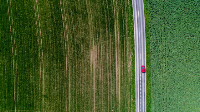 Car surrounded by fields, Genolier, Vaud Canton, Switzerland
