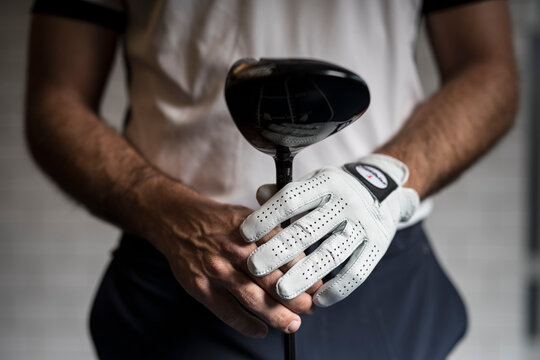 Golfer holding golf club