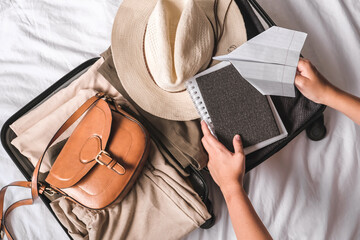  Travel.Suitcase.Girl traveler packing luggage in suitcase Travel,tourism,vacation,relocation.Mental health twellness,travel vacation.Unity, eco travel,travelling,good moments, digital detox
