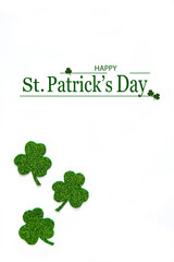 Happy St. Patrick's Day banner.Holiday background.St Patricks Day frame against a white background. Flat lay shamrocks.Copy space.Patrik's day banner