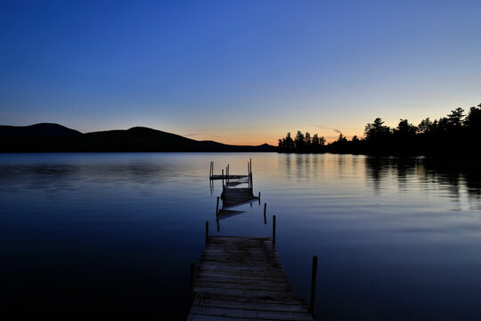 Silhouette Of Whiteface Mountain With Flooded Dock On Silver Lake