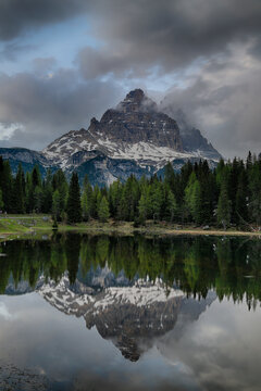 Reflection Of Tre Cime Di Lavaredo Peaks In A Small Pond Near Misurina, Dolomites, Italy