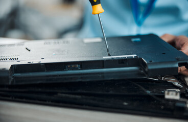 Laptop, technician and fixing with screwdriver, technology maintenance and repair hardware of pc....