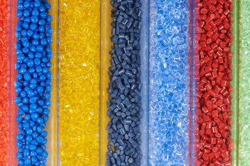 several colored plastic resins in test tubes in laboratory