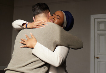 Hug, support and woman embrace a man for comfort, grief and care after bad news or problems in a...