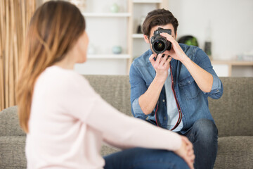 professional photographer working with model in studio