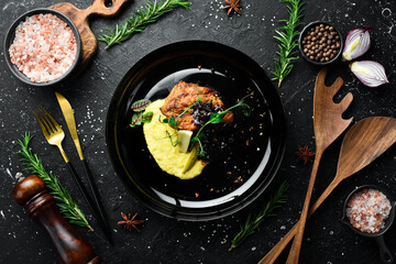 Baked pork steak with cherry sauce and spices. Restaurant menu. Rustic style.