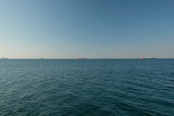 ships in the sea on the horizon