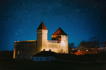 Kuressaare, Saaremaa Island, Estonia. Amazing Starry Sky Above Episcopal Castle In Night Time....