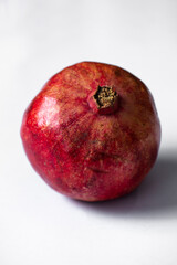 ripe pomegranate on a white background. selective focus. copy space.
