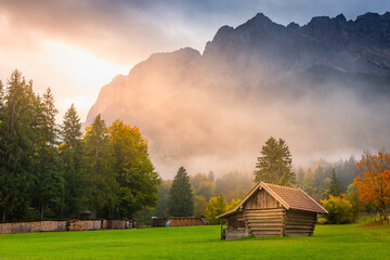 Bavarian alps and rustic farm barn, Garmisch, Zugspitze massif, Bavaria, Germany