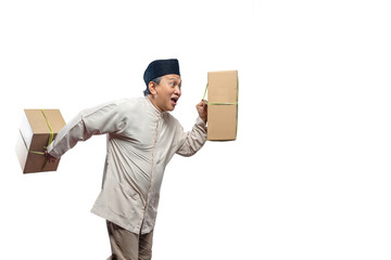 Asian Muslim man carrying box ready to mudik