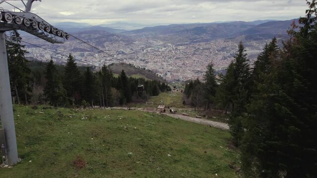 Aerial footage of cable car that connecting the city of Sarajevo to the mountain Trebevic