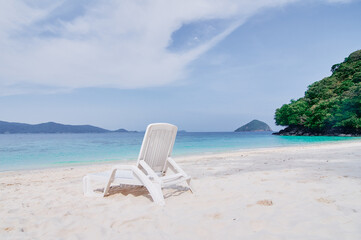 Vacation concept. Traveling by Thailand. Tropical Sea Beach with sunloungers.