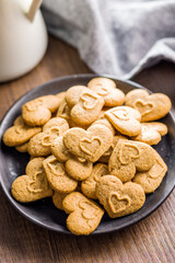 Sweet gingerbread hearts on plate.