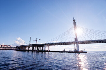 Sunny day in Saint Petersburg. Big city bridge on Neva river.