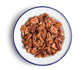 Peeled pecan nuts in bowl isolated on white background.