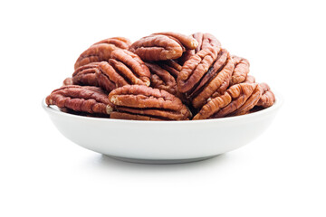 Peeled pecan nuts in bowl isolated on white background.