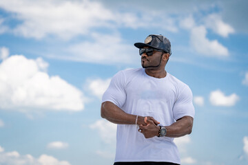 Stylish man in white t-shirt. Handsome male person in casual urban style.